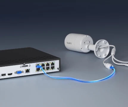 Reolink RLN8-410 12-Channel PoE NVR for 24/7 Continuous Recording being plugged into white bullet camera